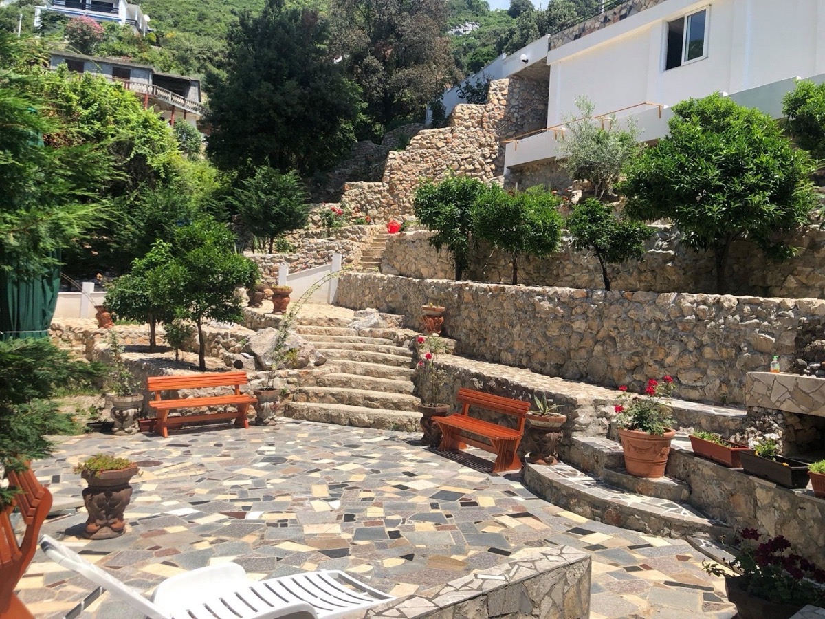 Azura Bay Hotel exterior — Mediterranean architecture overlooking the sea