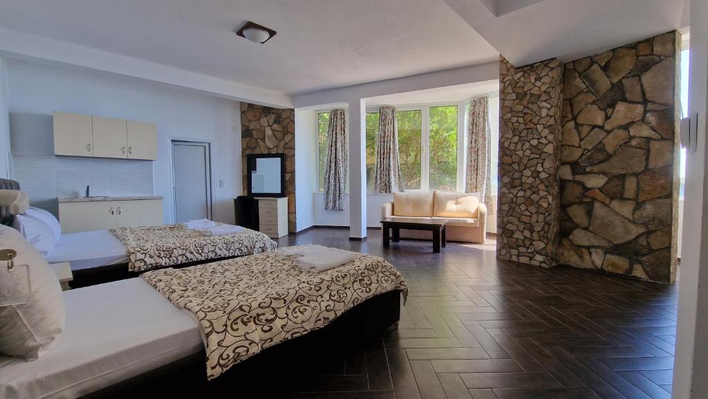 Family Room at Azura Bay — spacious, two beds, kitchenette and sea view